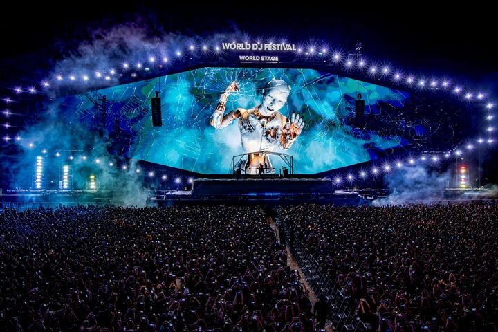 Main stage of World DJ Festival in Seoul with massive lights and crowd at Seoul Land amusement park