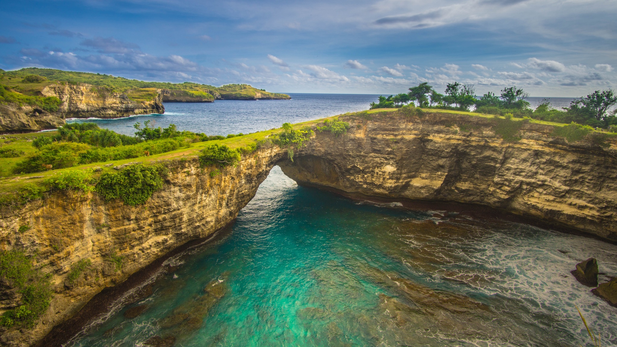 Broken Beach natural limestone arch at Nusa Penida, Bali, with turquoise water below